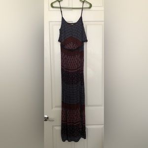 Maxi dress with slit in the front and peep hole in the back